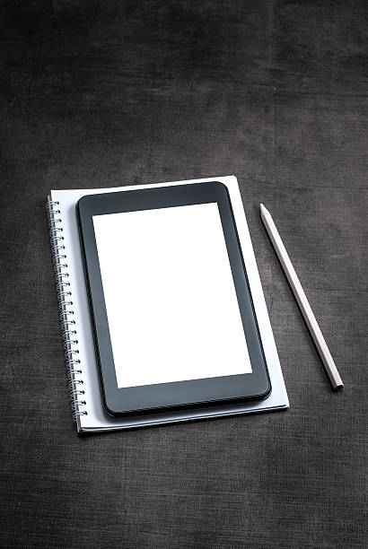 istock White blank screen on the tablet pc on wooden background 499514684