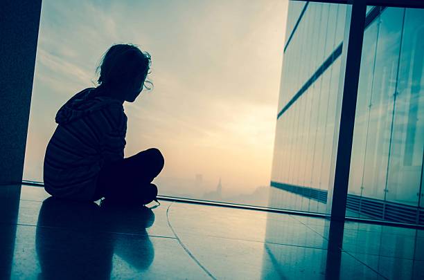 istock child by the window 499515022