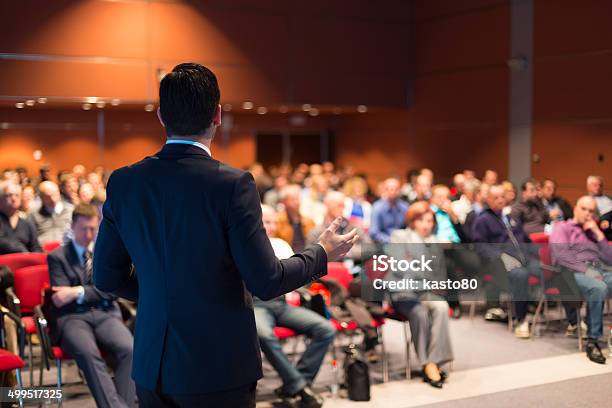 A Man Speaking At A Business Conference Stock Photo - Download Image Now - Meeting, Convention Center, Presentation - Speech