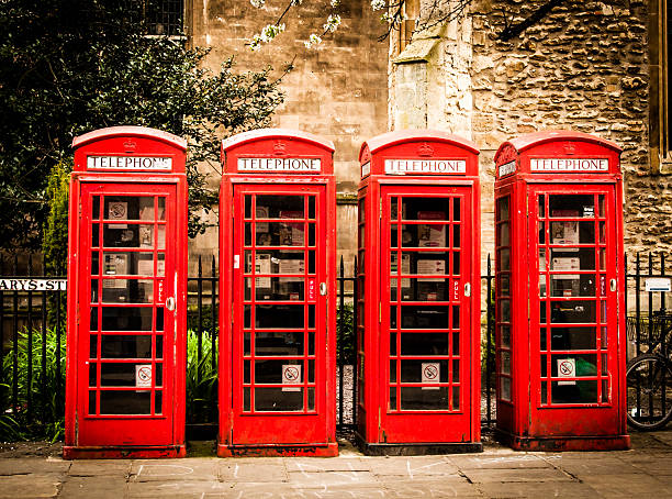 istock Row of british red telephone boxes 499517457