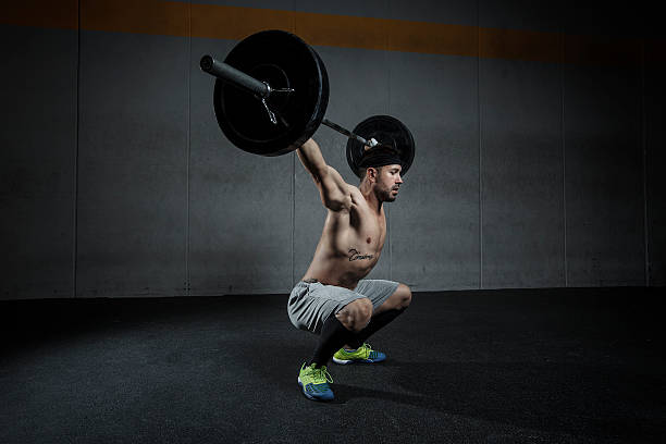 squat snatch weightlifting exercise  ganar stock pictures, royalty-free photos & images