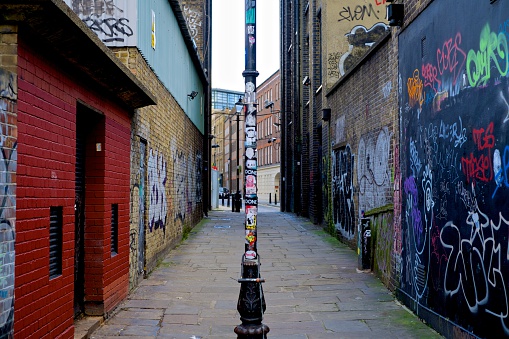 Empty graffiti coloured alleyway in East London