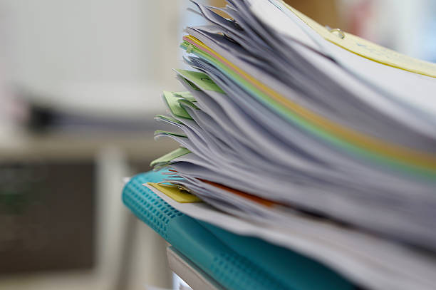 istock Pile of documents and blue file 499518572