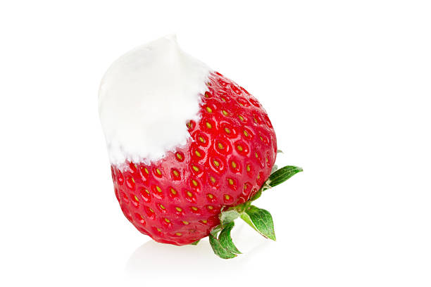 istock strawberries with cream  on the white background 499519339