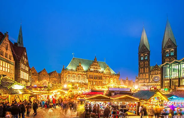 Bremen´s beautiful Christmas market at the city´s town square with the illuminated town hall, St. Peter's Cathedral, and parliament.