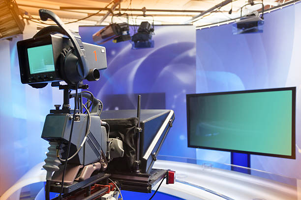 istock TV NEWS studio with camera and lights 499519773