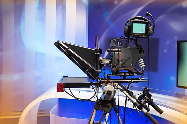 istock TV NEWS studio with camera and lights 499519785