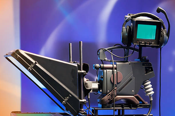 istock TV NEWS studio with camera and lights 499519853