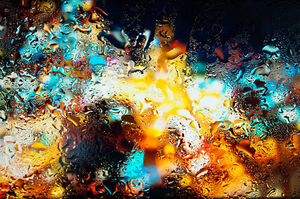 istock Night city through a wet window 499520216