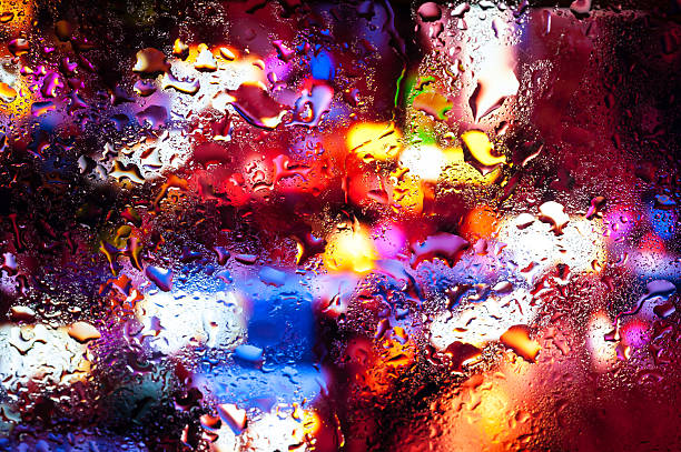 istock Night city through a wet window 499520312
