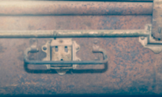 Rustic vintage suitcase blurred for background