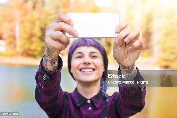 Hiker Girl Using Smartphone At The Mountain Stock Photo - Download Image Now - 2015, Adventure, Beauty