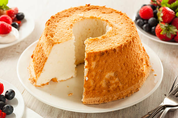 Homemade Angel Food Cake Homemade Angel Food Cake with Fresh Berries cake stock pictures, royalty-free photos & images
