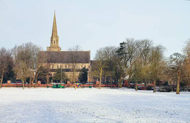 This is St. Mark's Church on a snowy morning in December 2010, photographed in horizontal format from Faringdon Road Park, Swindon, Wiltshire. The church was designed by the prolific Victorian architect Sir George Gilbert Scott, and it opened in 1845. BrunelÆs Great Western Railway (the GWR) had arrived in Swindon in 1840, with the first industrial works opening on 2nd January 1843. By 1848 the original workforce of 423 had swelled to 1800, and St. Mark's was clearly built to serve its spiritual needs. The area now known as The Park, or Faringdon Road Park, was purchased in 1844 by the GWR from Lt. Col. Vilett, a local landowner. Its original purpose was for use as a cricket ground, and it was known as The Cricket Field. The New Swindon cricket team played there from 1847.