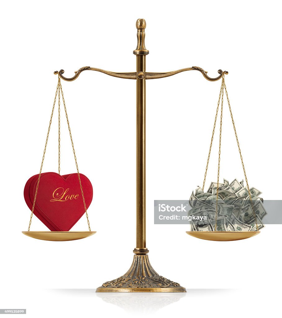 Equal Weighted: Love and Money There is heart shaped red box at the one side of "Scales of Justice" while there is money on the other side. In this version, love and money are equal weighted. Clean image and isolated on white background. Currency Stock Photo