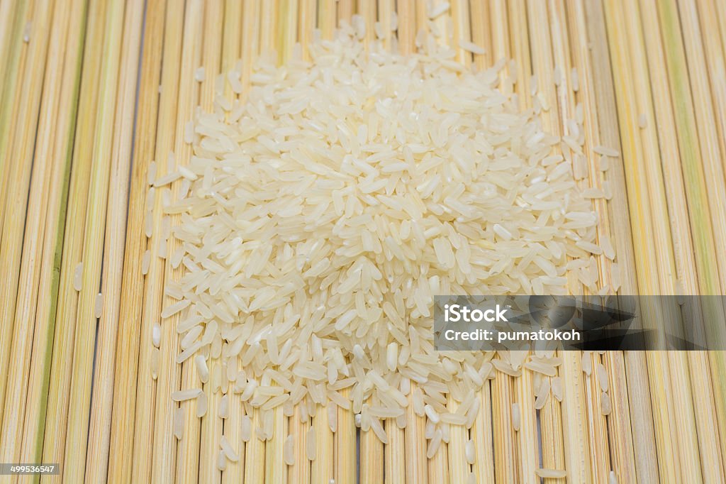 Rice on bamboo  background calories cereal closeup cooking corn crop cuisine culture food diet dietary dieting dinner east eating Abstract Stock Photo
