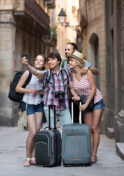 istock Group of tourists making selfie 499537112