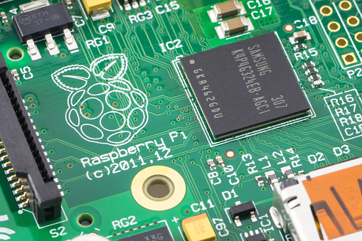 Arad, Romania - May 18, 2014: Close-up of a Raspberry Pi Model-B Rev2. The Raspberry Pi is a credit-card-sized single-board computer developed in the UK by the Raspberry Pi Foundation. Studio shot.