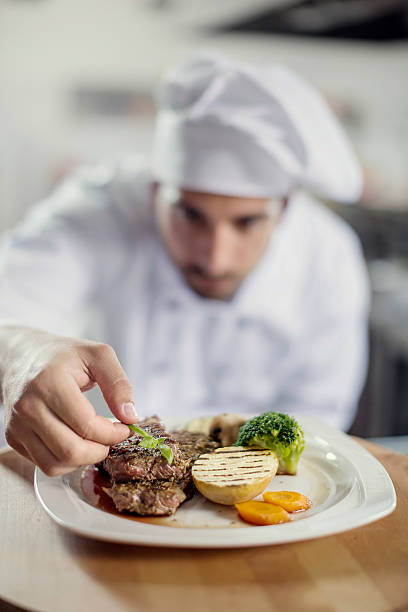 istock Male chef showing food 499539130
