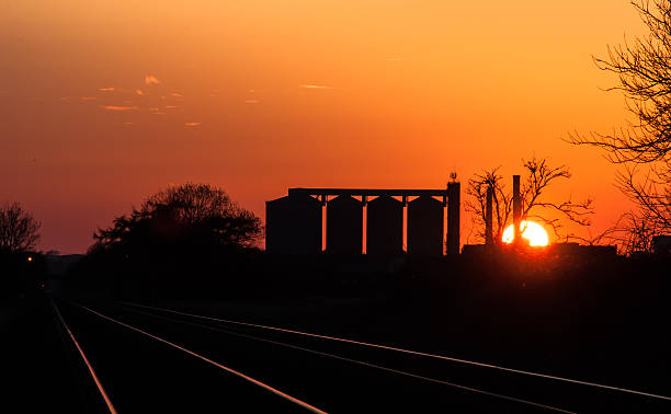 Sunset of Bury St Edmunds Sunset of Bury St Edmunds at Cattishall level crossing, Great Barton, Bury St Edmunds bury st edmunds photos stock pictures, royalty-free photos & images