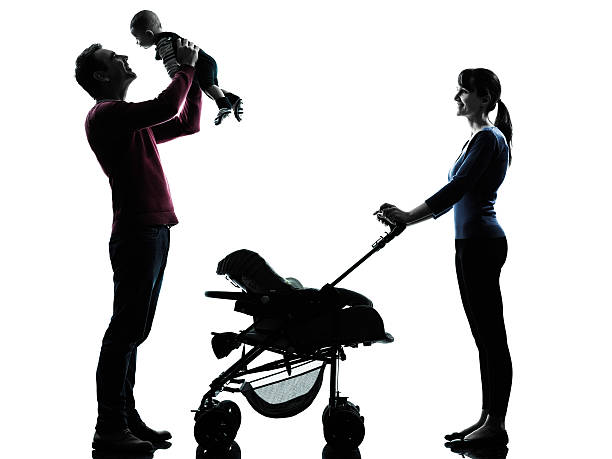 istock parents with baby silhouette 499539289