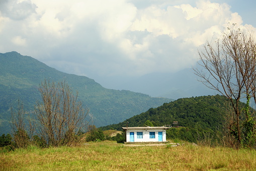 Isolated cottage in the outskirts of Dhampus village at the foothills of the Himalayas on the trek rout surrounding the Annapurnas range. Kaski district-Gandaki zone-Nepal.