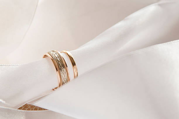istock White decorations with gold wedding rings 499542798