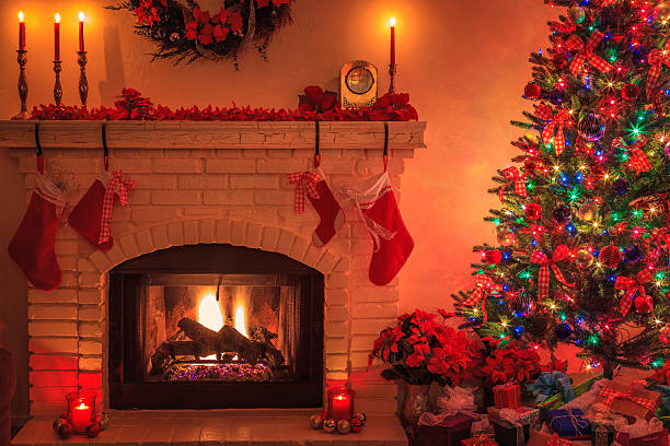 istock Christmas Tree with lit fireplace, ornaments, lights, candles, presents (P) 499543486