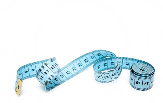 Blue spiral measuring tape isolated on white background.