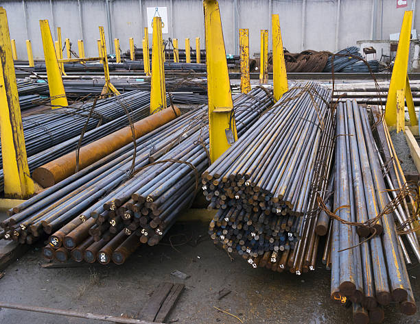 istock steel round bars in factory warehouse 499544708