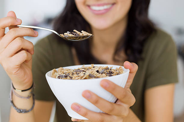 istock Beautiful young woman enjoying breakfast at home. 499545140