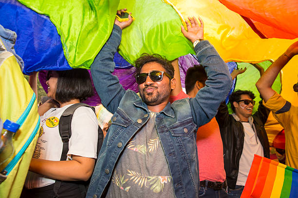 Delhi Queer Pride -2015 New Delhi, India - November 29, 2015: Delhi Queer Pride -2015 indian couple kiss stock pictures, royalty-free photos & images