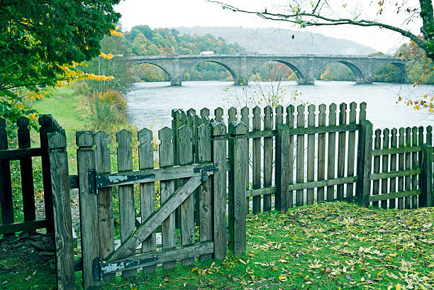 Fence and bridge on Tay River in Dunkeld Scotland