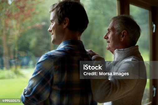 istock Thoughtful father and son in cottage 499550575