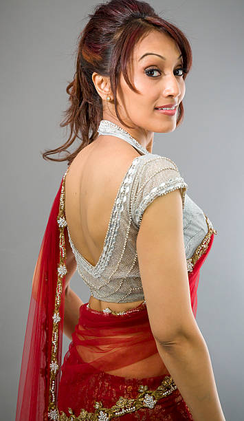 Side profile of an Indian young woman smiling