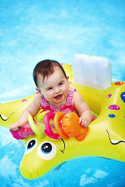 istock Baby girl in the pool 499553451