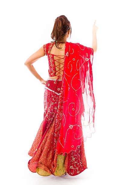 istock Young Indian woman pretending to work on touch screen 499554681