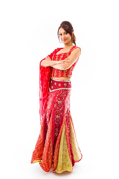 istock Confident Indian young woman standing with arms crossed 499556037