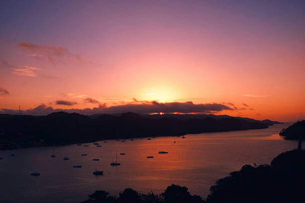 istock Red sunset marina boat, Samana Bay, Dominican republic 499557885