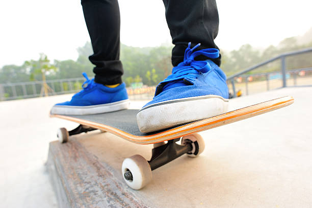 istock Legs in sneakers on a skateboard 499558549