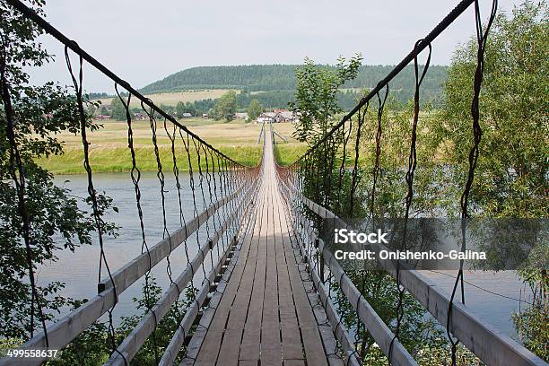 Rural Landscape With The Suspended Bridge Stock Photo - Download Image Now - Architecture, Blue, Cloud - Sky