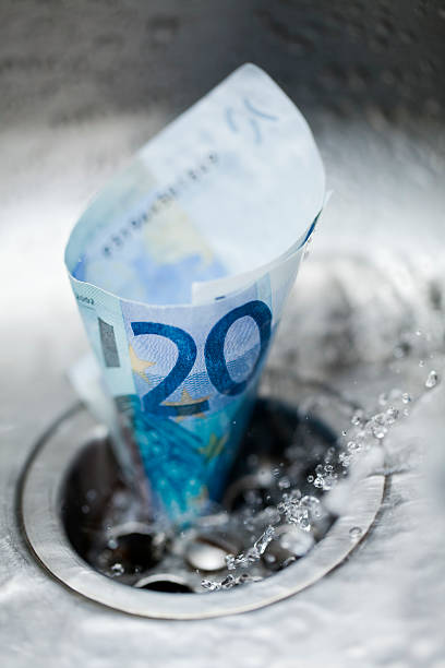 istock Twenty euro bank note down the drain. 499564661