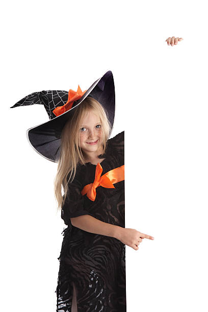 istock Little Playful Witch Holding a Sign . 499564719