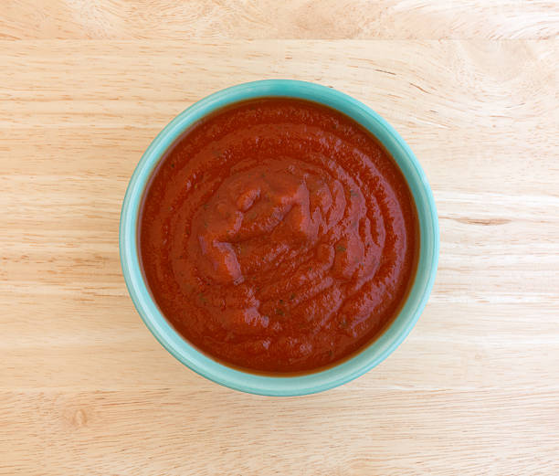 istock Bowl of spaghetti sauce on a wood table top. 499566426