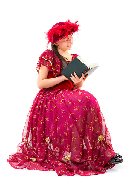 istock Little girl in retro clothes reading book 499566641