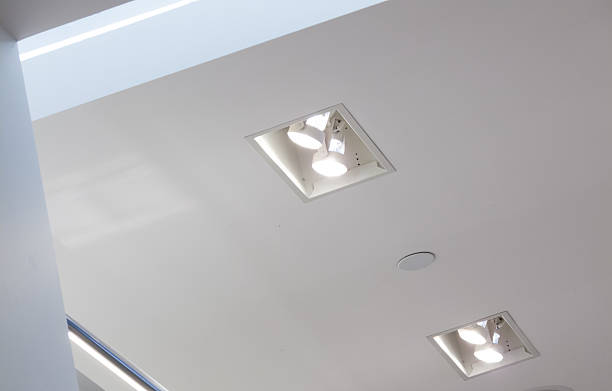 istock Low angle view of electric lights fixed in ceiling 499567313