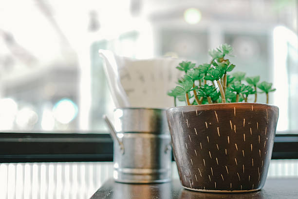 istock Pot of plastic plant on the table 499567756
