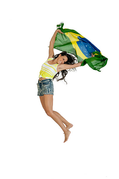 young attractive girl jumping with Brazil flag stock photo