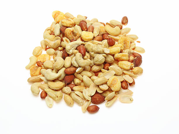istock Various kind of nuts in a white background 499568436