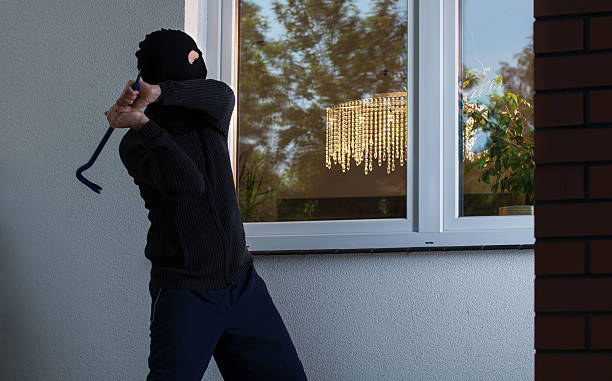 istock Burglar tries to smash a window 499568525